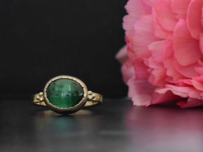 Queen B yellow gold and oval green tourmaline ring by Emmanuelle Zysman